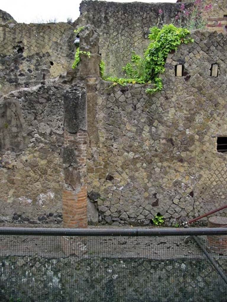 V.11, Herculaneum. May 2003. West exterior wall at souther nboundary. 
Photo courtesy of Nicolas Monteix.
V.11 is on the left and in centre, on the right (with holes for support beams of an upper floor) is V.8.
