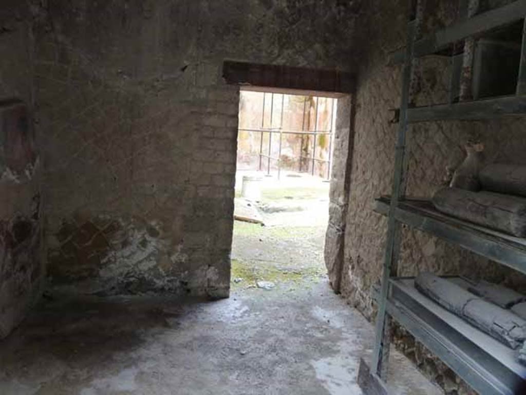V.12, Herculaneum, September 2015. West wall of shop. According to Maiuri, leaning against the west wall was a simple wooden cupboard with horizontal boards.
See Maiuri, Amedeo, (1977). Herculaneum. 7th English ed, of Guide books to the Museums Galleries and Monuments of Italy, No.53 (p.46).

