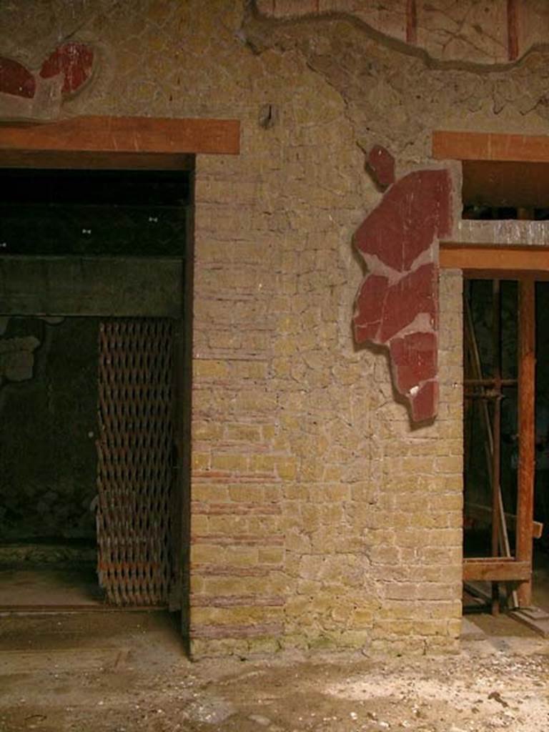 V.15 Herculaneum. May 2005. 
West side of atrium, with west (right) ala with sliding gate, on left, and doorway to central room on west side, on right.
Photo courtesy of Nicolas Monteix.
