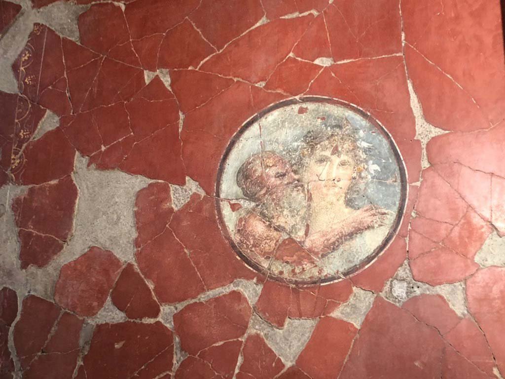 V.15 Herculaneum. October 2019. East wall of tablinum at north end, medallion with painting of an old Silenus and Maenad.
Photograph © Parco Archeologico di Pompei.

