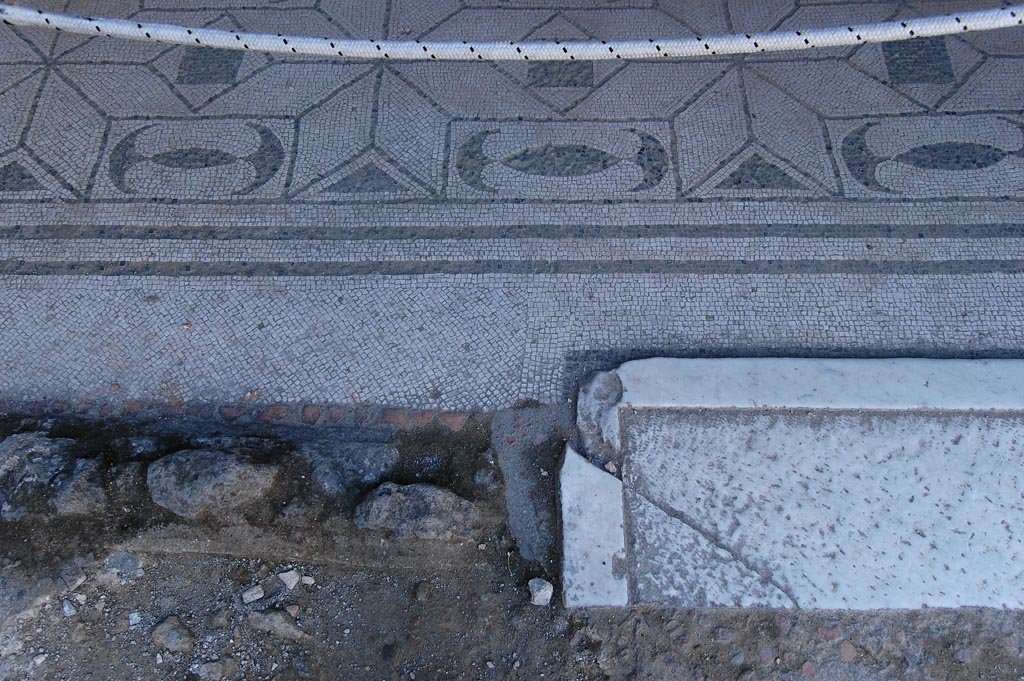 V.30 Herculaneum, May 2011. Oecus 1, detail of doorway threshold and flooring. Photo courtesy of Nicolas Monteix. 