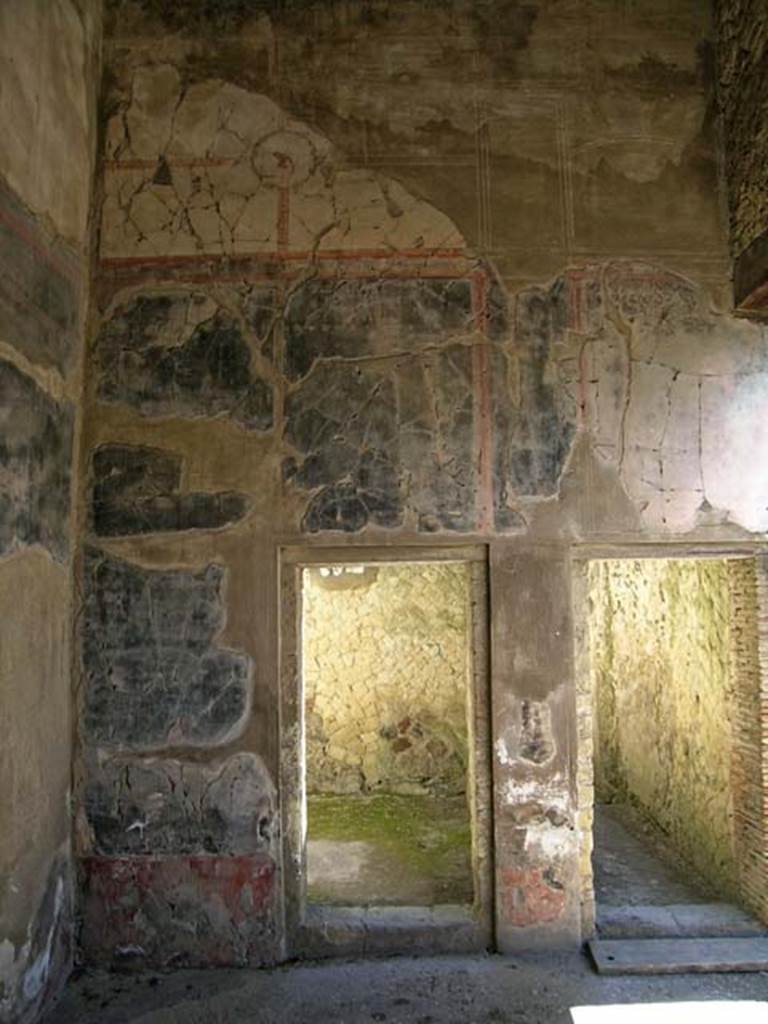 V.35 Herculaneum. June 2005.
North wall of Ala 10, with doorway to cubiculum 5, on left, and to corridor 8, on right.
Photo courtesy of Nicolas Monteix.
