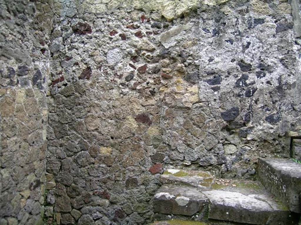 V.35, Herculaneum. May 2005. Looking towards east wall of kitchen 9, with steps to upper floor. 
Photo courtesy of Nicolas Monteix.

