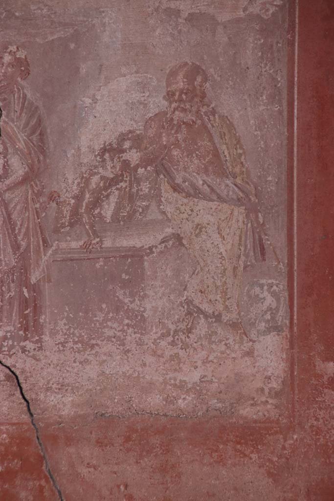 V.35 House of Great Portal. October 2020. 
Triclinium 1, detail from central wall painting of Silenus, seated between two satyrs.  
Photo courtesy of Klaus Heese.
