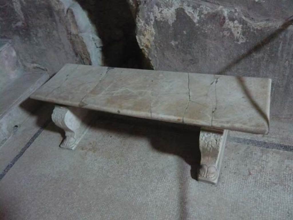 VI.8, Herculaneum. August 2013. Marble bench on east side. Photo courtesy of Buzz Ferebee.