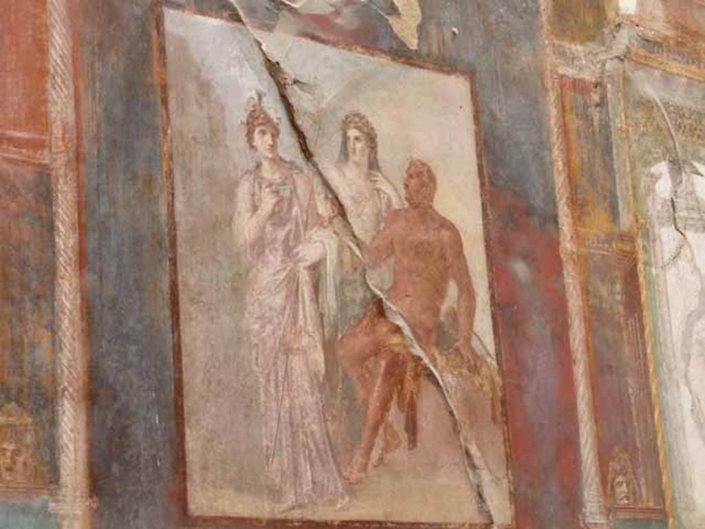 Ins.VI.21, Herculaneum. May 2010.  East wall.  Wall painting of Hercules being welcomed to heaven by Minerva (on left with helmet) and Juno (on right).
