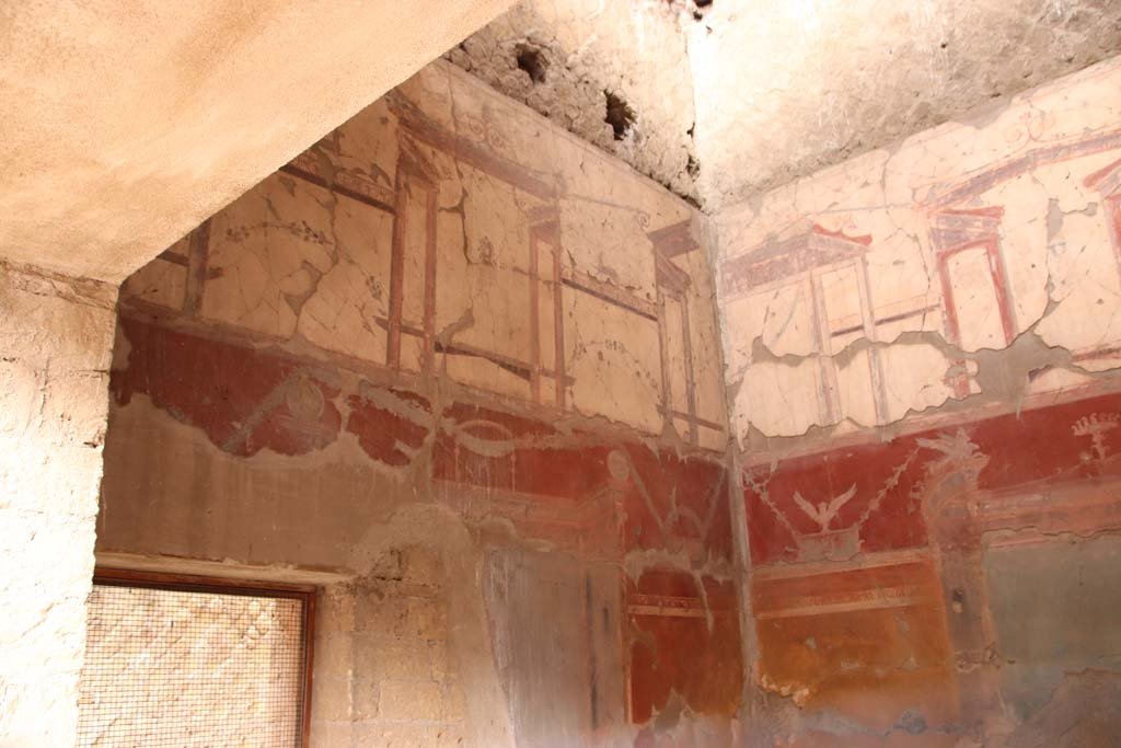 VI.29 Herculaneum. October 2020. 
Room 7, oecus, looking towards west wall and north-west corner, through window in south wall. Photo courtesy of Klaus Heese.
