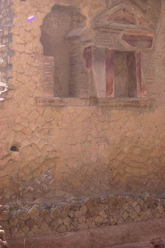 VI.29, Herculaneum. Not dated. South wall of second atrium, with two lararium niches. 
Photo courtesy of Nicolas Monteix.

