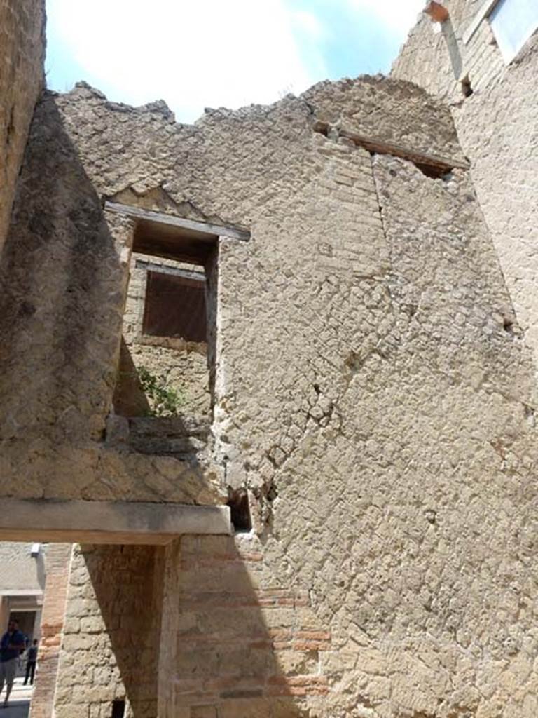 VI.29, Herculaneum. May 2018. Room 12, west wall with blocked doorways in upper wall. 
Photo courtesy of Buzz Ferebee.
