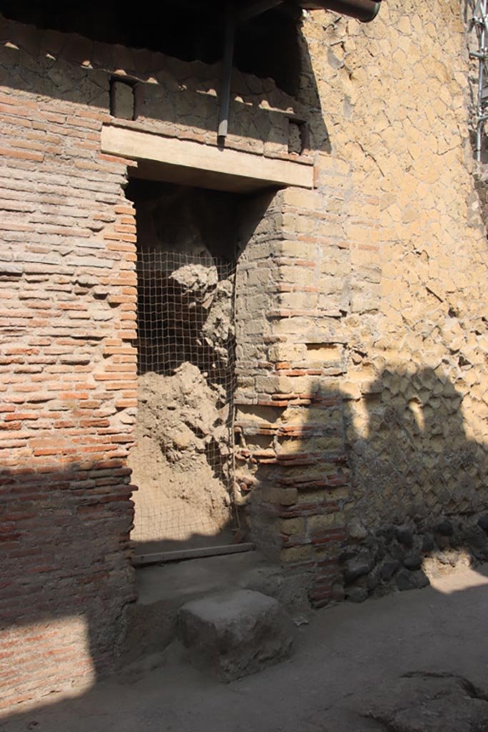 VII.14 Herculaneum. October 2023. 
Doorway on west side of Cardo III. Photo courtesy of Klaus Heese.
