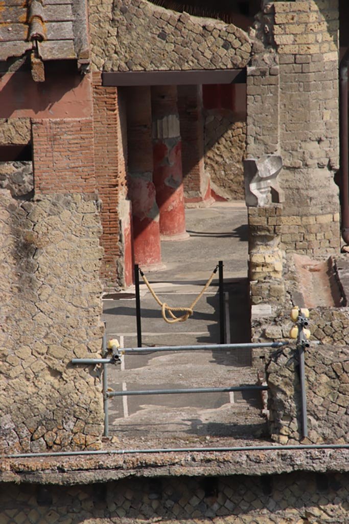 Ins. Or. I.1, Herculaneum. October 2023. 
Looking north to doorway from collapsed loggia, to corridor leading to atrium. Photo courtesy of Klaus Heese.
