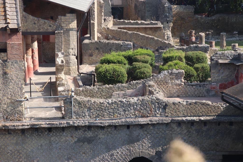 Ins. Or. I.1, Herculaneum. October 2023. 
Looking north towards remains of room 9, in centre, and room 10, on right, with painted decoration, and window onto garden. 
Photo courtesy of Klaus Heese.
