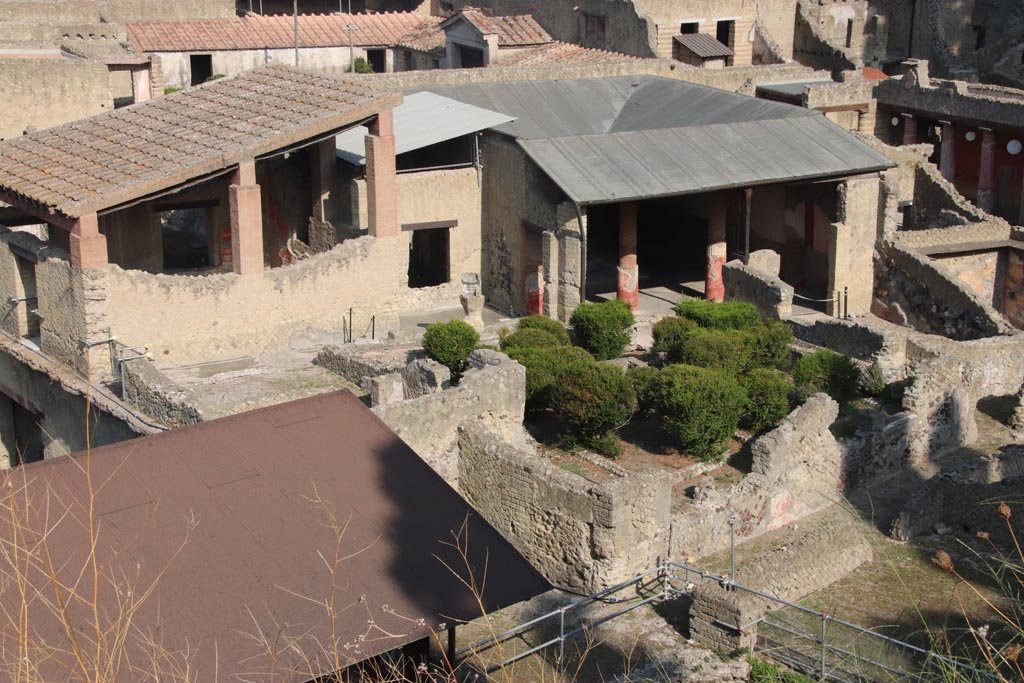 Ins. Or. I.1, Herculaneum. October 2023. 
Looking north-west from access roadway, across garden area towards atrium. Photo courtesy of Klaus Heese.
