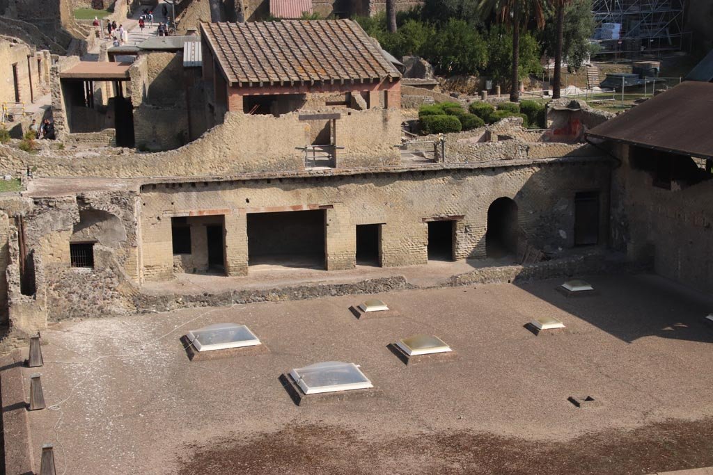 Ins. Or. I.1a, Herculaneum. October 2023. 
Looking north from access roadway towards lower floor rooms opening south onto a vaulted corridor. Photo courtesy of Klaus Heese.
