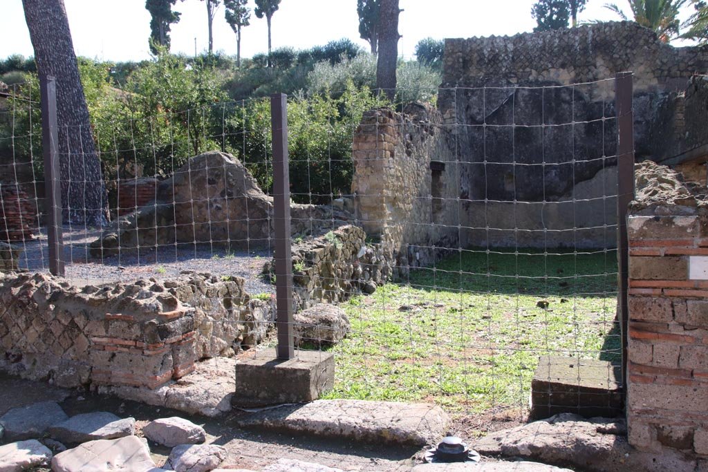 Ins. Orientalis I.3, Herculaneum, October 2022. 
Looking east from entrance doorway across courtyard leading into stables area. Photo courtesy of Klaus Heese.
