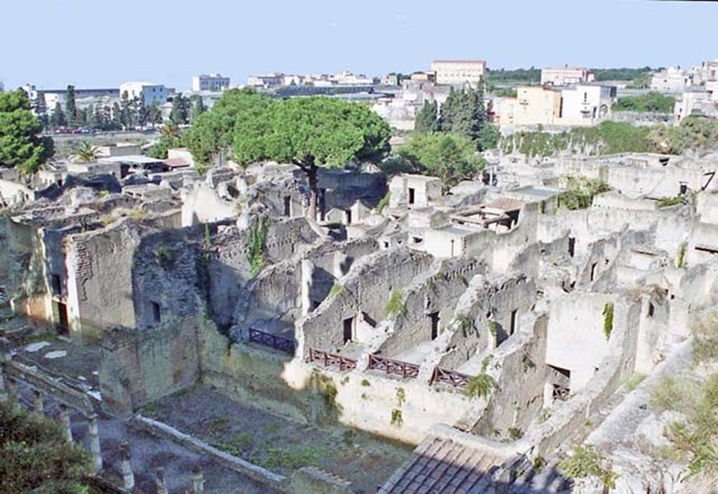 Ins. Orientalis II 4, Herculaneum. October 2001. Looking south-west across rear of Ins. Or. II, from entrance roadway above the Palaestra. The large apsed room can be seen on the left.  Photo courtesy of Peter Woods.

