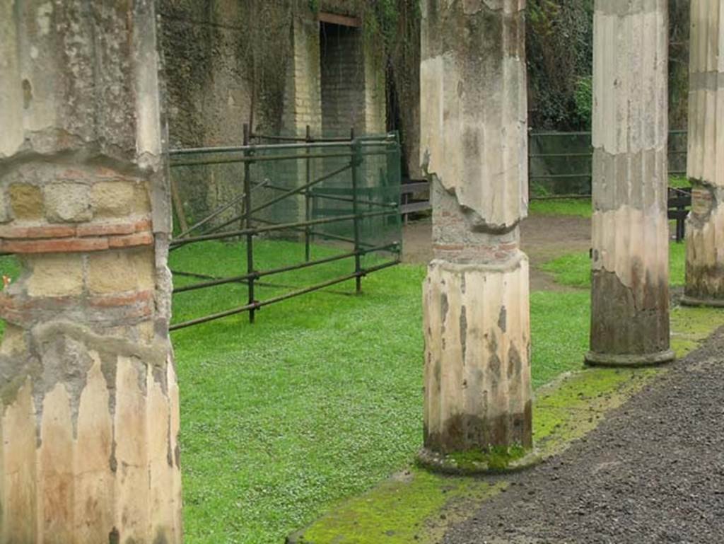 Ins Or II, 4, Herculaneum. December 2004. 
Looking across west portico towards entrance to the still unexcavated part of the Palaestra, centre left.
Photo courtesy of Nicolas Monteix.
