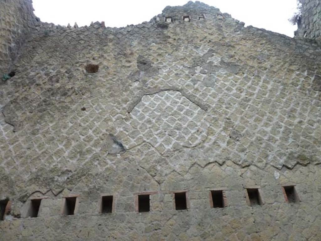 Ins. Orientalis II.5, Herculaneum. September 2015. Rear east wall with holes for support beams for floors, at various levels.