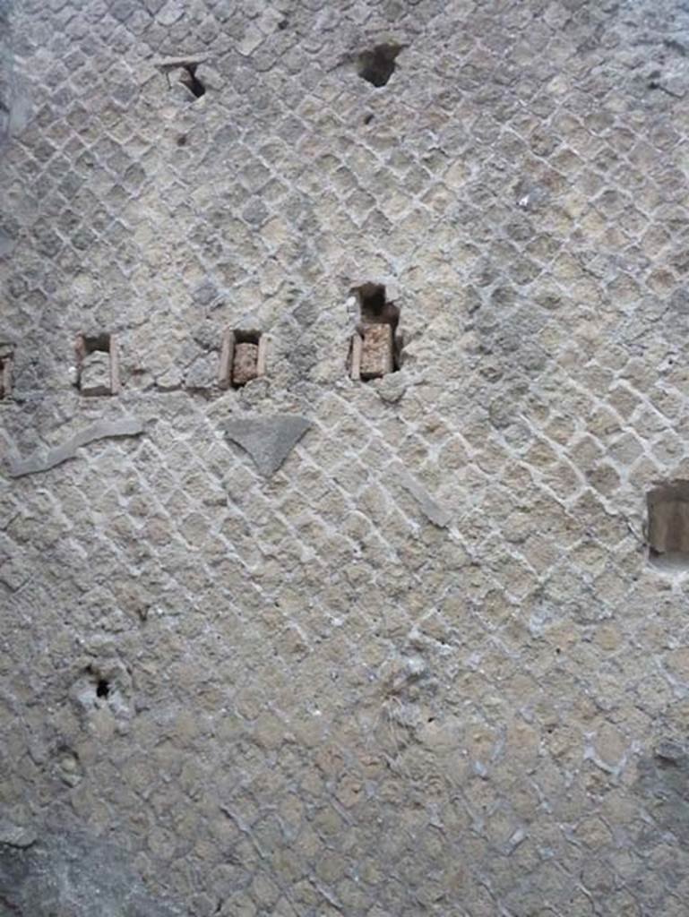 Ins. Orientalis II.10, Herculaneum. September 2015. 
North wall of rear room (b), with holes for support beams for an upper floor, west end.
