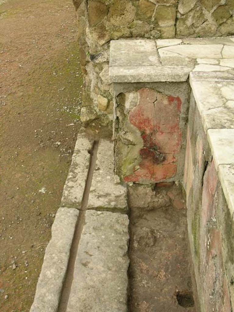 Ins Or II. 13, Herculaneum. December 2004. North end of counter and threshold of doorway. 
Photo courtesy of Nicolas Monteix.

