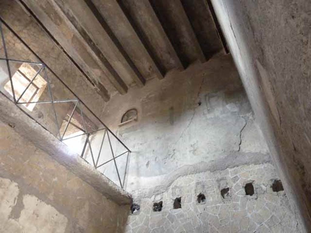 III.11 Herculaneum. May 2010. Room 3, looking towards the upper south-west corner, with remains of holes for support beams for flooring.  