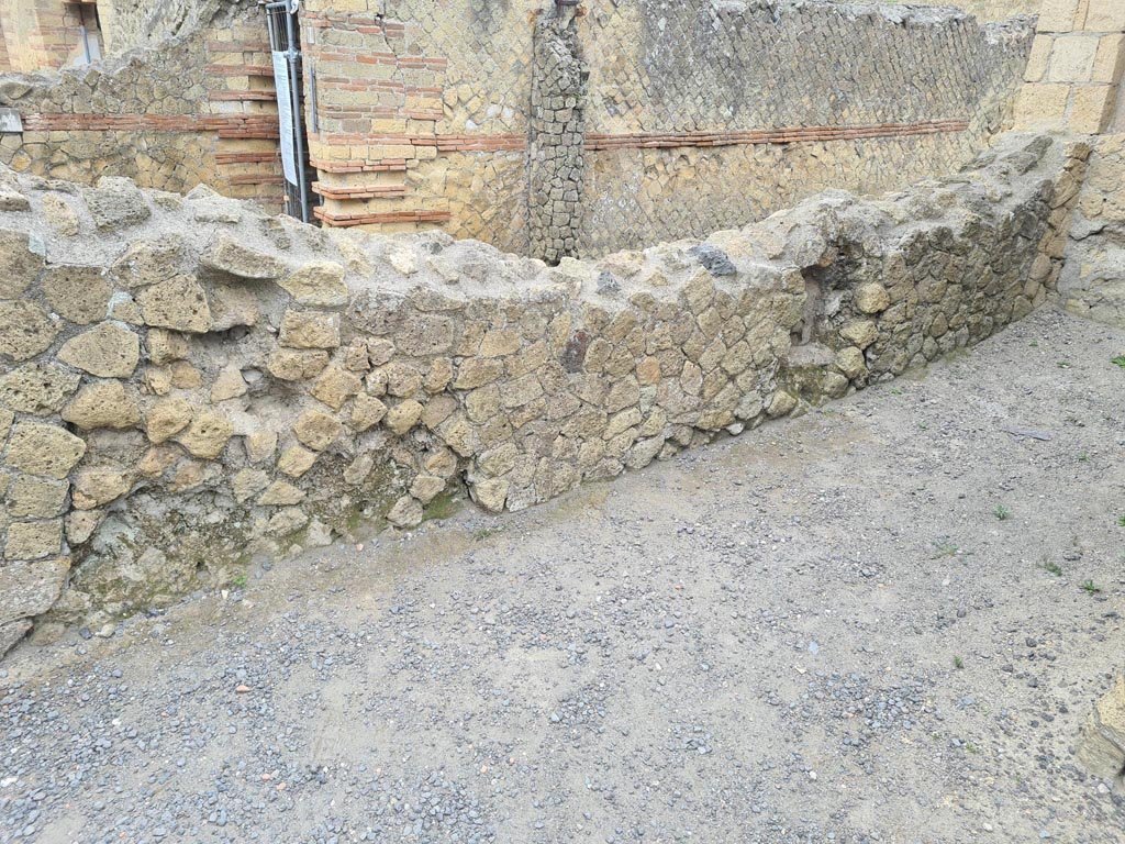 III.19/18/1 Herculaneum, May 2024. 
Room 7, or room (a), east wall with lararium niche, according to Maiuri, “a little height from the floor”. Photo courtesy of Klaus Heese.
