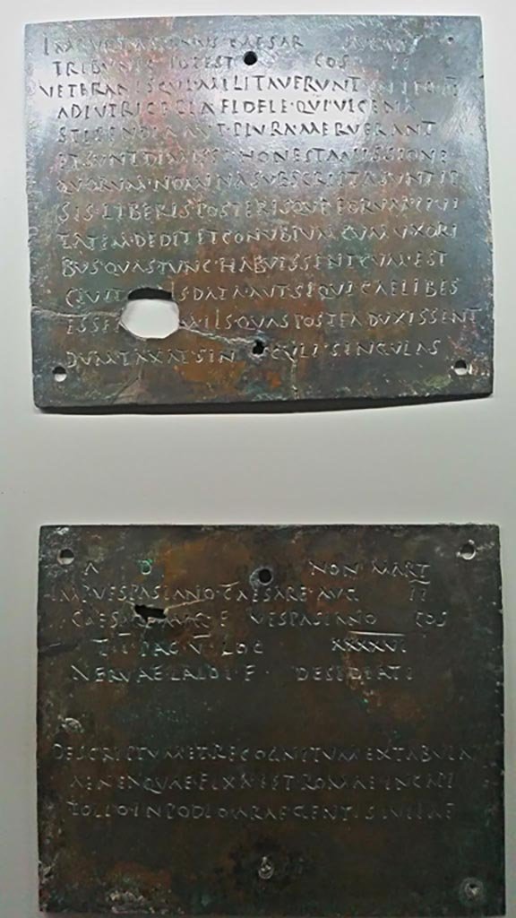 Herculaneum, insides of tablets 1 (upper) and 2 (lower), parts 2 and 3 of the diploma.
Bronze military diploma of Nerva Desidiatus, son of Laidus, found Herculaneum but provenance unknown.
On display in Naples Archaeological Museum, inventory number 3725. Photo courtesy of Giuseppe Ciaramella, June 2017.

