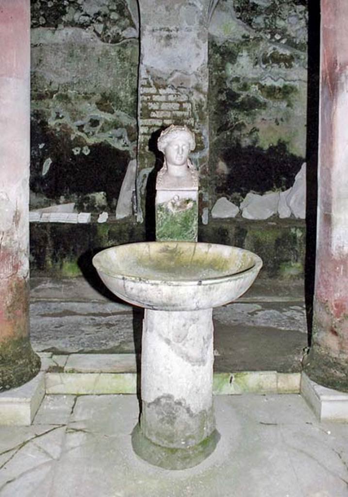 Suburban Baths, Herculaneum. October 2001. Fountain bust of Apollo in the atrium. 
Photo courtesy of Peter Woods.
