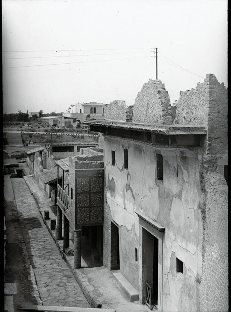 Cardo IV Inferiore, Herculaneum. 1932. P.C. H.36. Photo by P. C. 
Looking south along the west side of Cardo IV Inferiore, towards doorway of III.11, the House of the Wooden Partition,
Used with the permission of the Institute of Archaeology, University of Oxford. 
File name instarchbx92im005 Resource ID 41154.
See photo on University of Oxford HEIR database