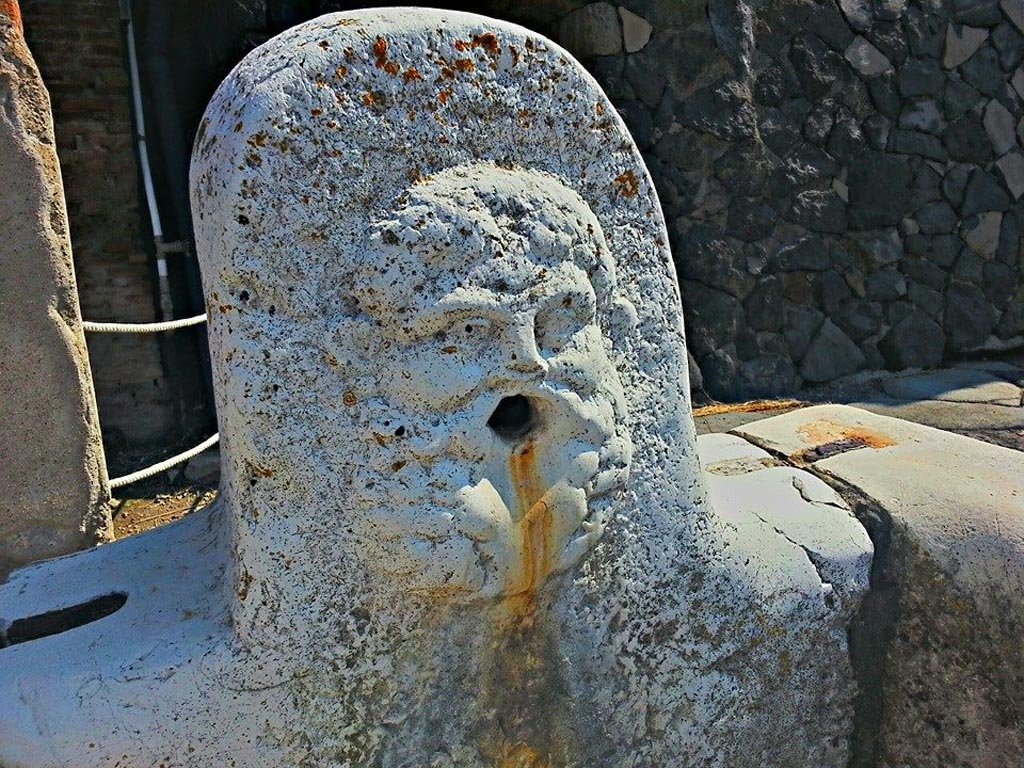 Decumanus Maximus, east end. Photo taken between October 2014 and November 2019. 
Fountain decorated with head of Hercules. Photo courtesy of Giuseppe Ciaramella.

