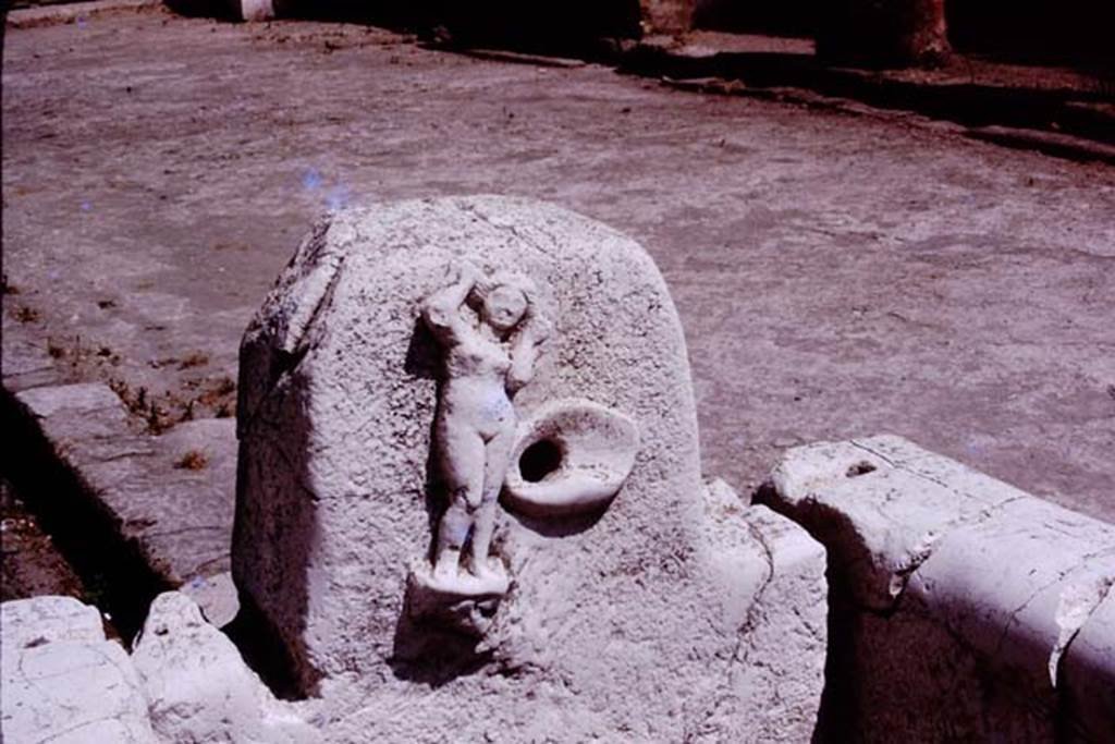 Fountain of Venus, Decumanus Maximus with the figure of Venus, Herculaneum. 1975. 
Photo by Stanley A. Jashemski.   
Source: The Wilhelmina and Stanley A. Jashemski archive in the University of Maryland Library, Special Collections (See collection page) and made available under the Creative Commons Attribution-Non Commercial-License v.4. See Licence and use details.
J75f0706
